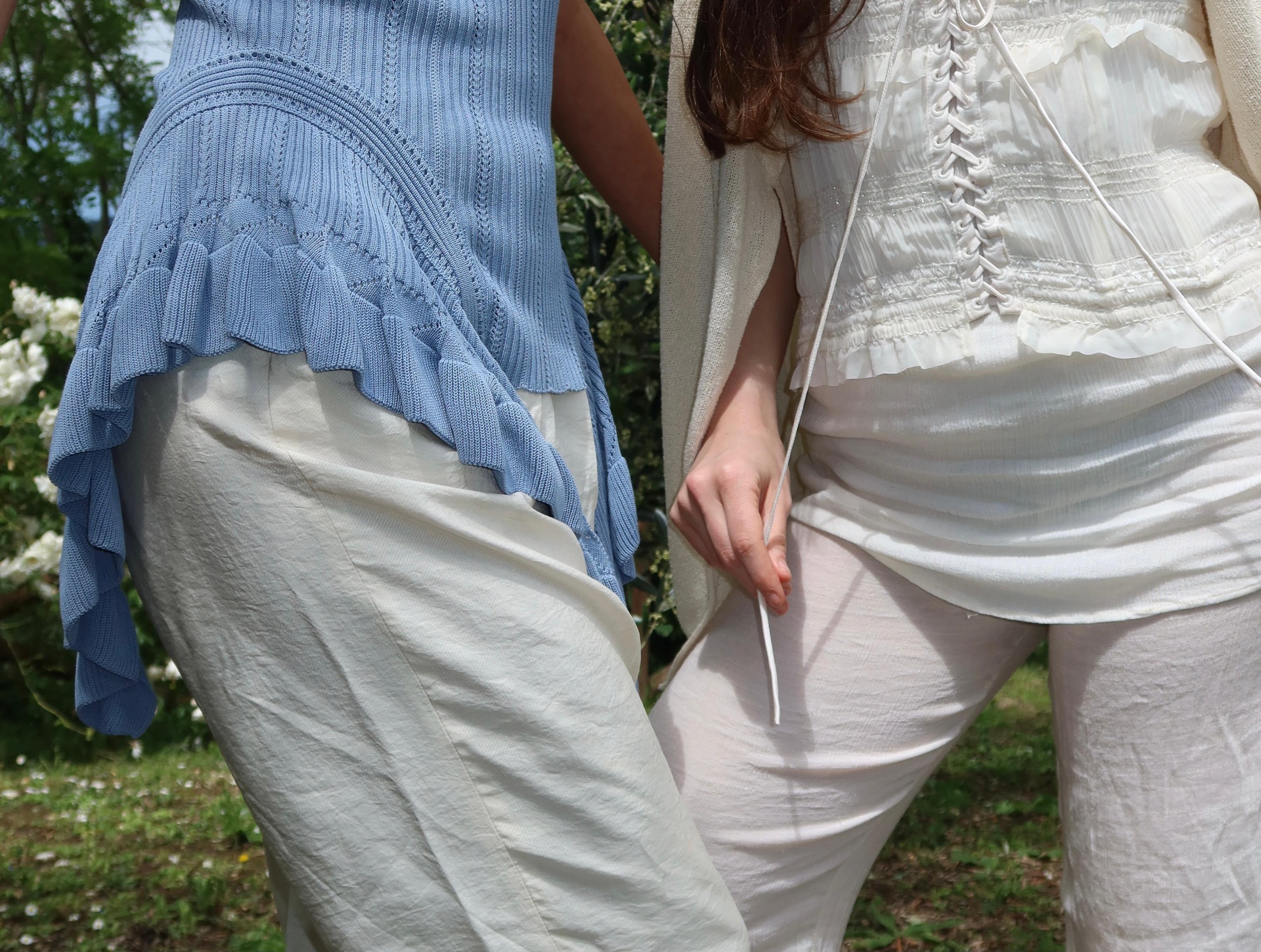 Garden of Eden — detail, blue ruffled knit and white corset